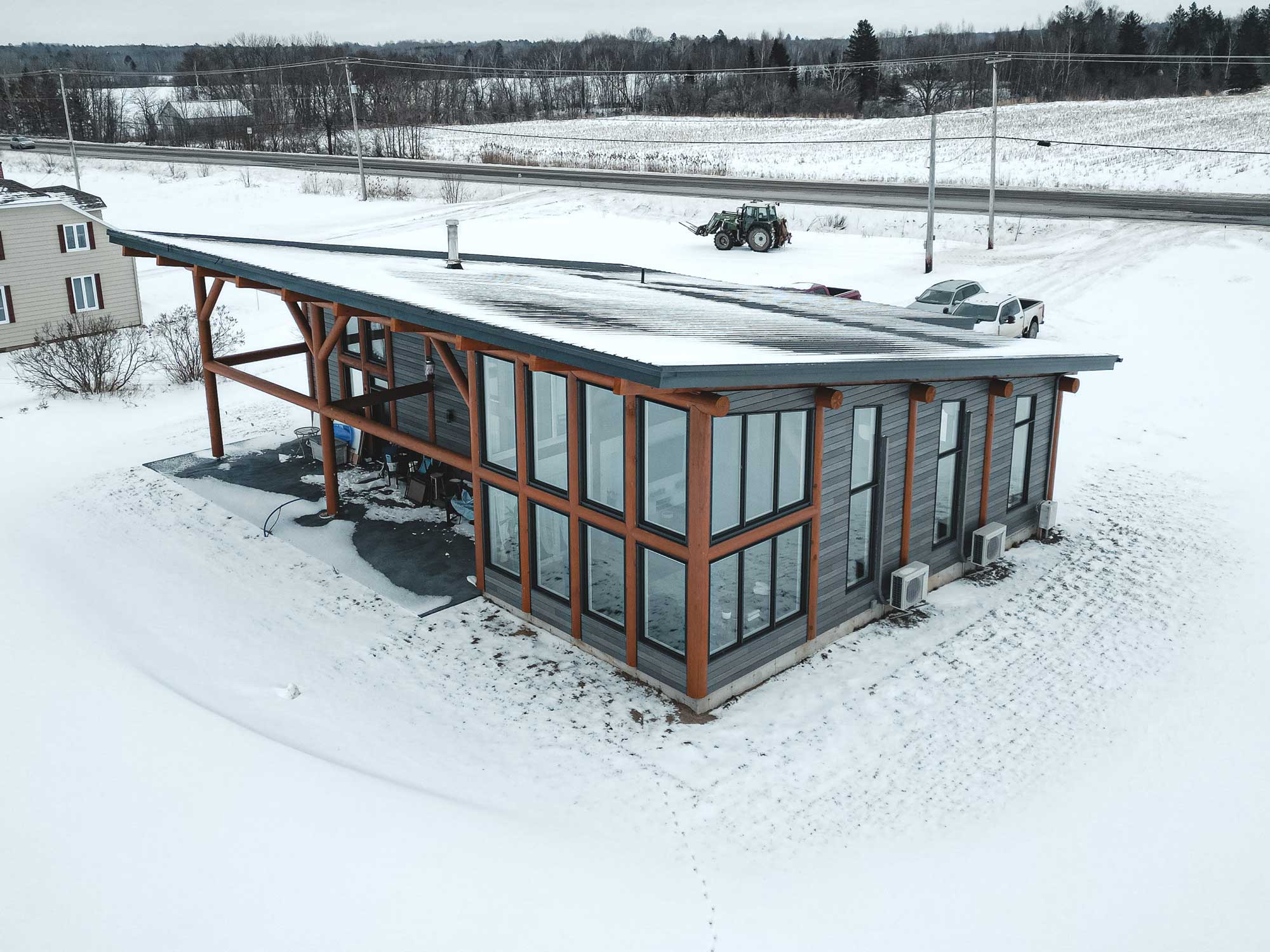 maison chalet bois rond contemporain hybride